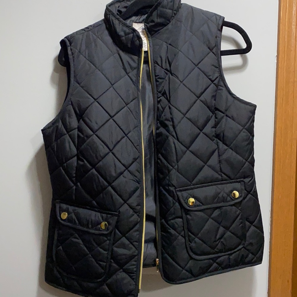 Black vest with gold button details. Brand is St. John’s bay